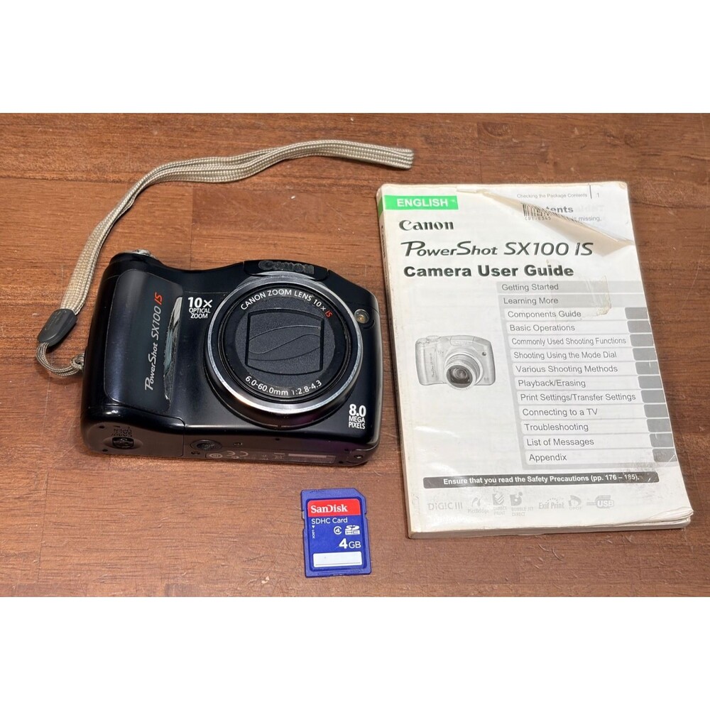 Canon PowerShot SX100 IS 8MP Digital Camera w/10x Zoom w/ SD Card & manual